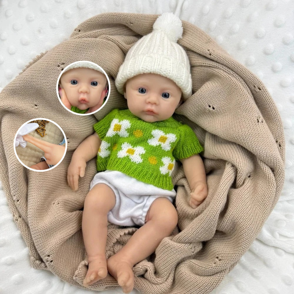30 cm vollständig aus Silikon gefertigtes Reborn Baby Mädchen mit grünem Blumenpullover