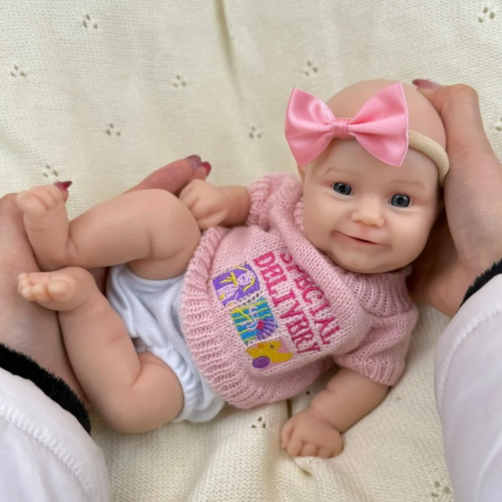 30 cm vollständig aus Silikon gefertigtes Reborn Baby Maddies Lächeln in rosa Outfits