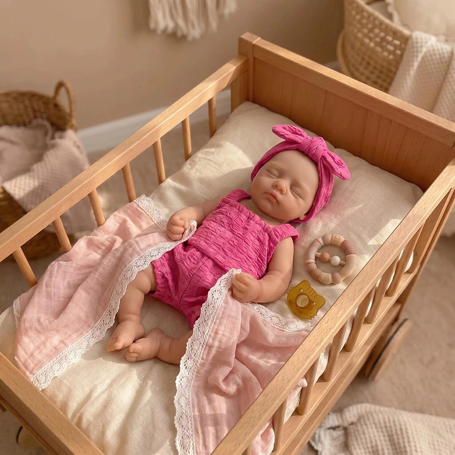 30 cm realistische Irys Reborn-Puppe aus Vollsilikon mit geschlossenen Augen in rosafarbenen Outfits