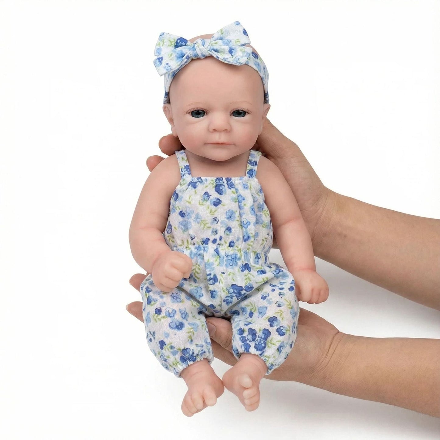 30cm vollständig aus Silikon gefertigte Felicia Reborn-Babypuppe im blauen Blumen-Jumpsuit