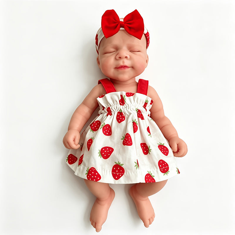 30cm weiches dehnbares Pascale Reborn Baby aus Vollsilikon mit geschlossenen Augen in einem Erdbeerkleid