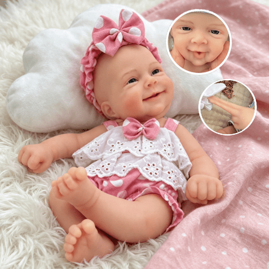 30 cm lächelndes Silikon Reborn Baby Sebastian Mädchen mit offenen Augen im rosa gepunkteten Body