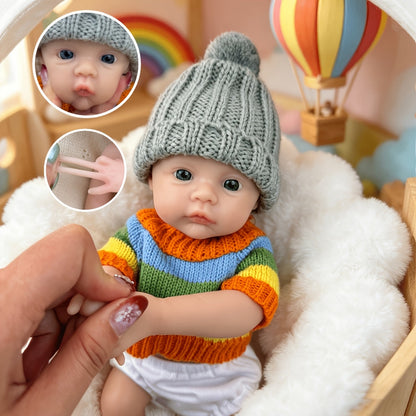 30 cm vollständig aus Silikon gefertigtes Reborn Baby Meadow Mädchen im bunten Streifenpullover
