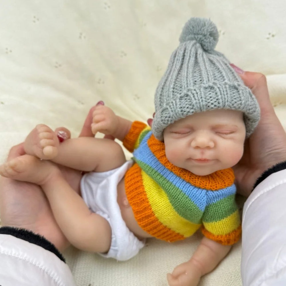 30 cm Pascale Reborn Puppe aus Vollsilikon Mädchen im bunten Streifenpullover