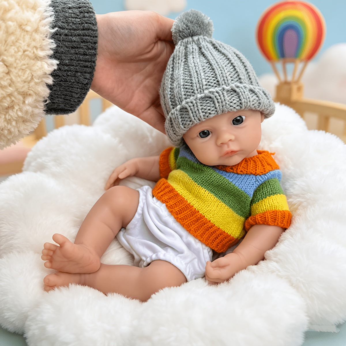 30 cm vollständig aus Silikon gefertigtes Reborn Baby Meadow Mädchen im bunten Streifenpullover