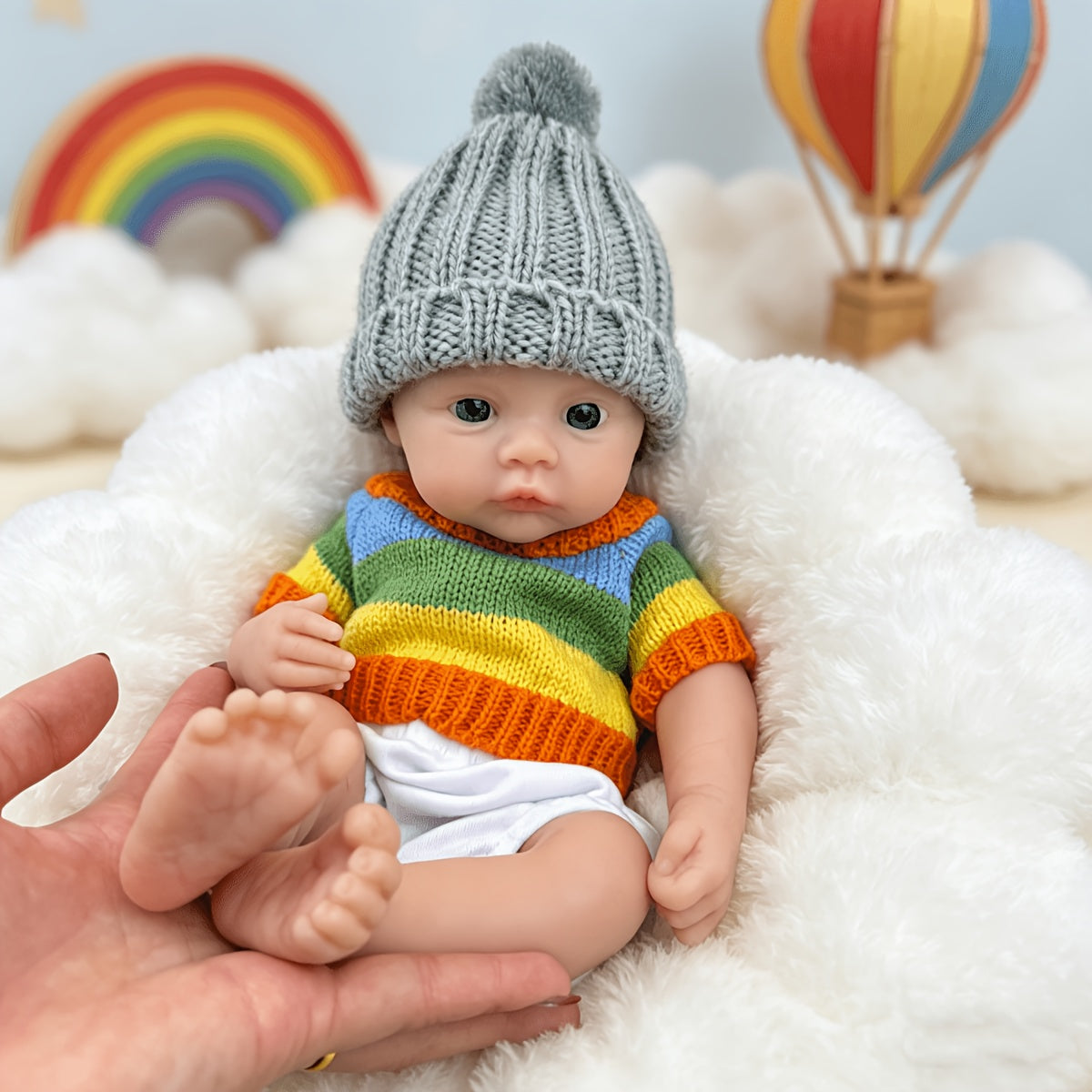 30 cm vollständig aus Silikon gefertigtes Reborn Baby Meadow Mädchen im bunten Streifenpullover