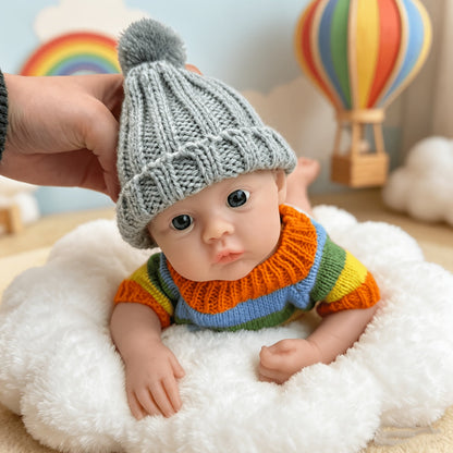 30 cm vollständig aus Silikon gefertigtes Reborn Baby Meadow Mädchen im bunten Streifenpullover