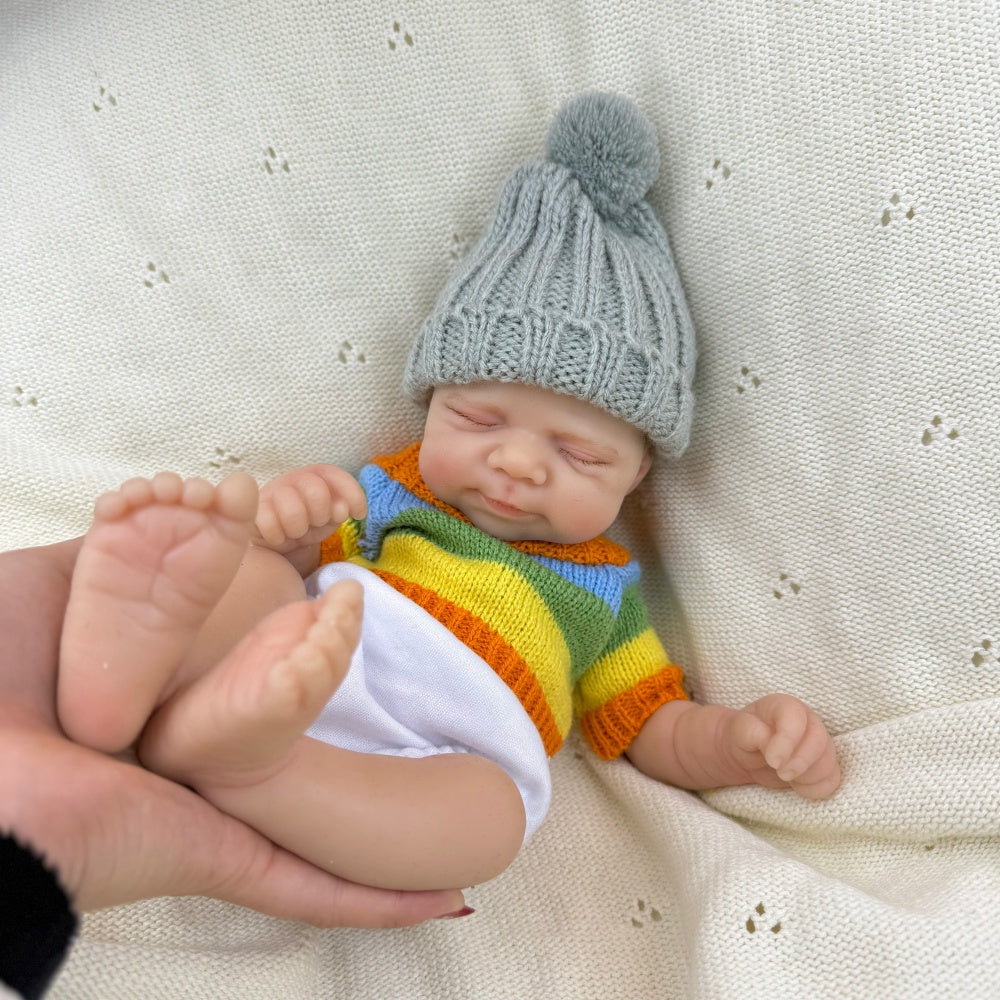 30 cm Pascale Reborn Puppe aus Vollsilikon Mädchen im bunten Streifenpullover