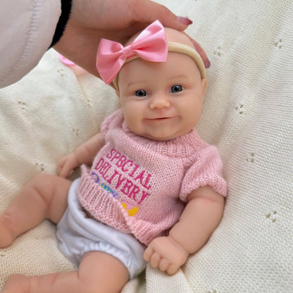 30 cm vollständig aus Silikon gefertigtes Reborn Baby Maddies Lächeln in rosa Outfits
