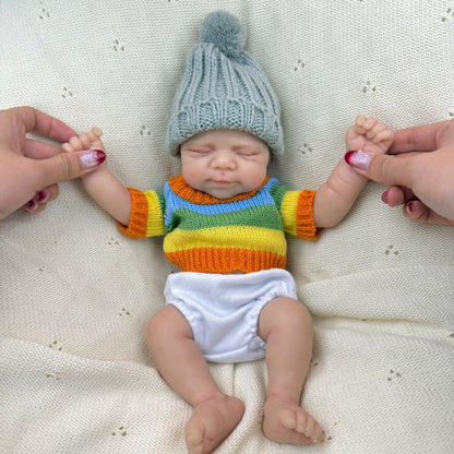 30 cm Pascale Reborn Puppe aus Vollsilikon Mädchen im bunten Streifenpullover