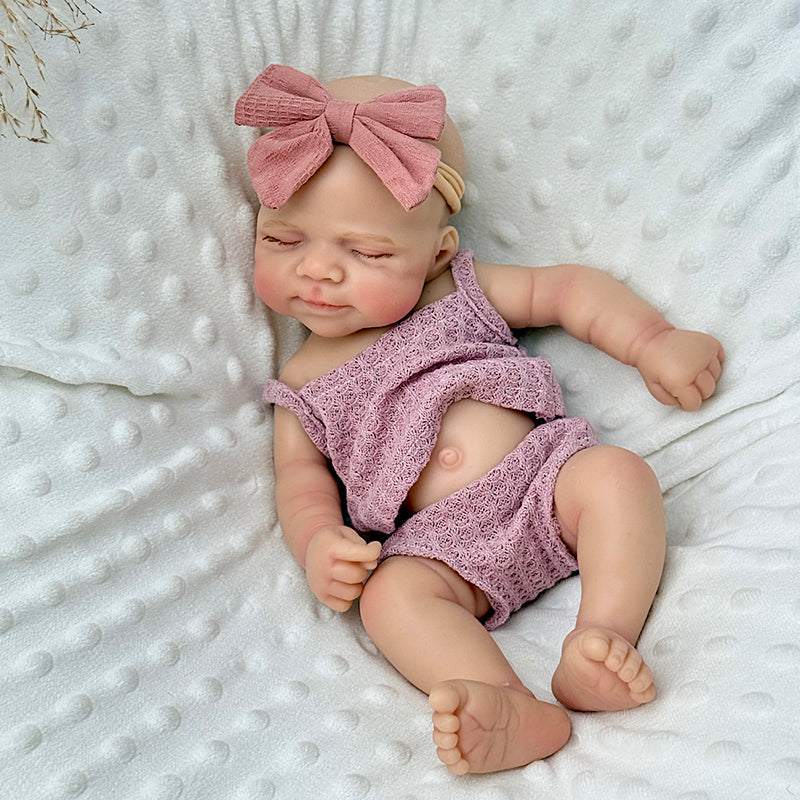 30 cm lebensechte Reborn Babypuppe Pascale aus Vollsilikon mit geschlossenen Augen in lila Outfits