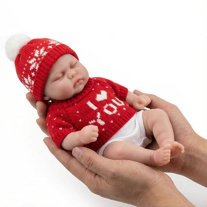 30 cm vollständig aus Silikon gefertigte Reborn Puppe Pickle mit geschlossenen Augen im roten Pullover
