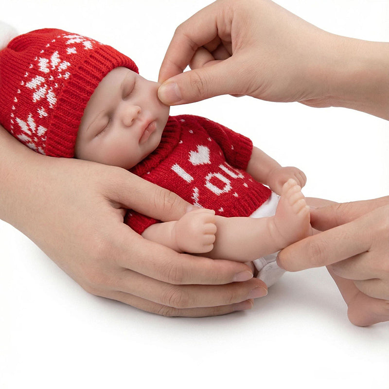 30 cm vollständig aus Silikon gefertigte Reborn Puppe Pickle mit geschlossenen Augen im roten Pullover