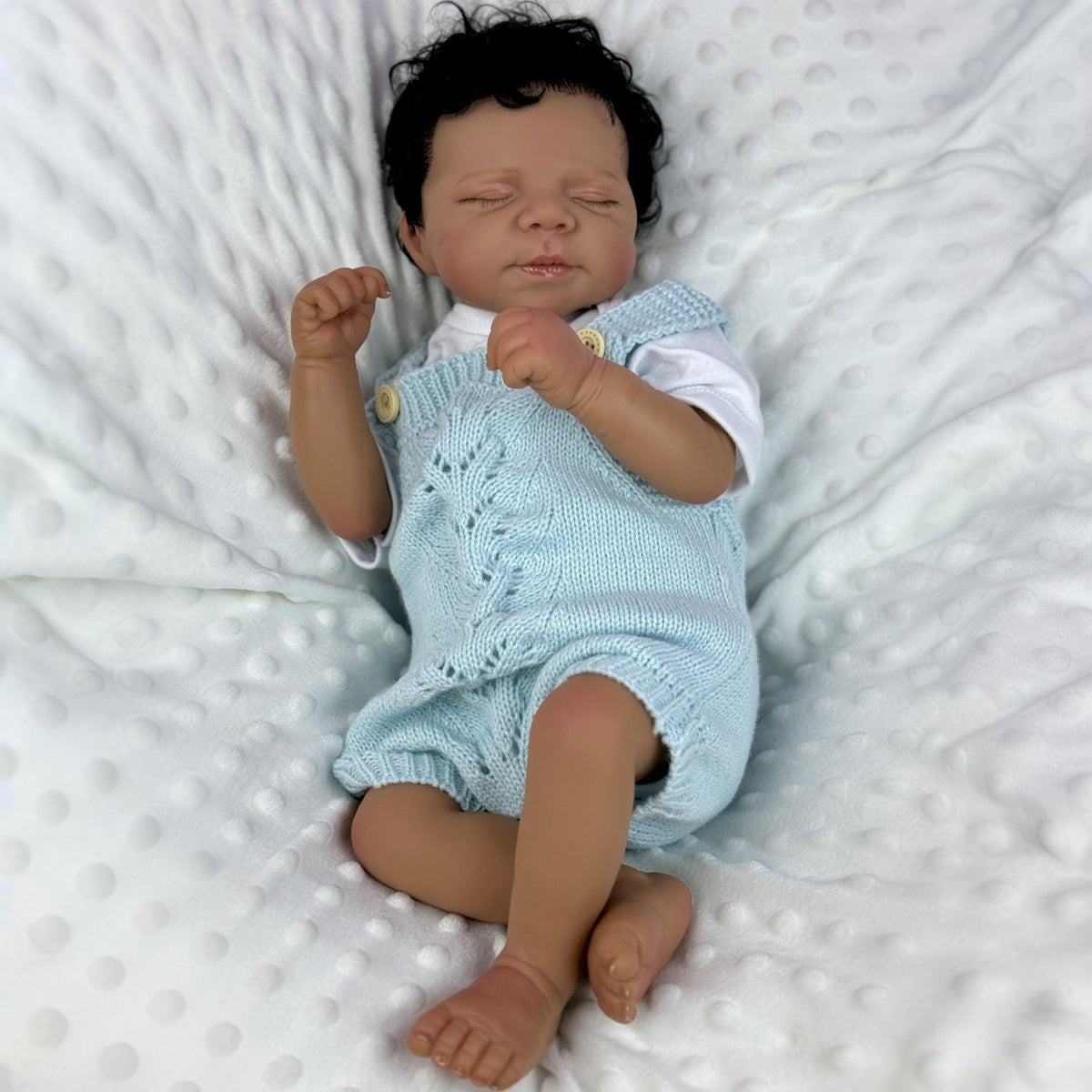 48cm lebensechte Reborn-Puppe Pascale mit weichem Körper dunkler Haut und geschlossenen Augen