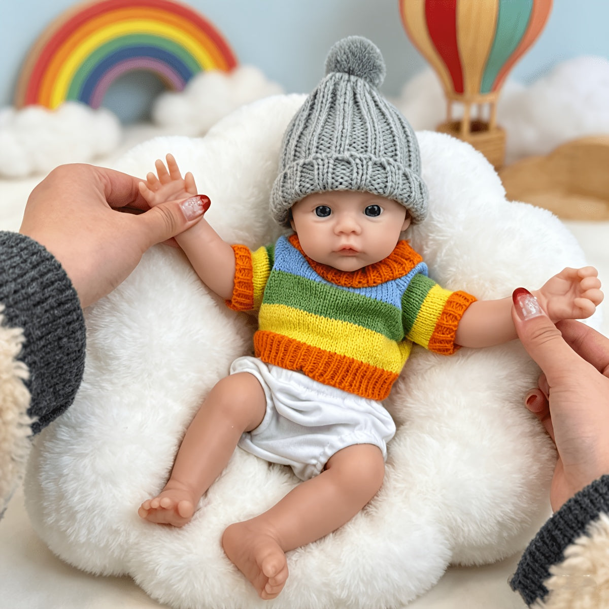 30 cm vollständig aus Silikon gefertigtes Reborn Baby Meadow Mädchen im bunten Streifenpullover
