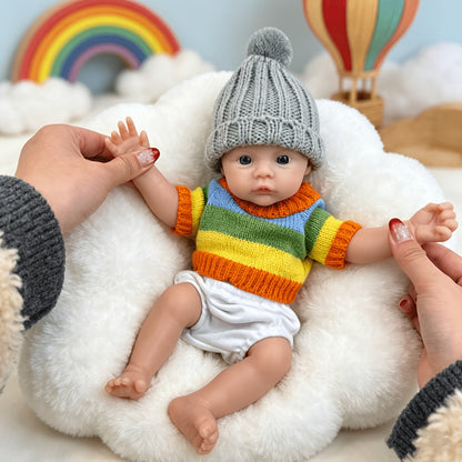 30 cm vollständig aus Silikon gefertigtes Reborn Baby Meadow Mädchen im bunten Streifenpullover