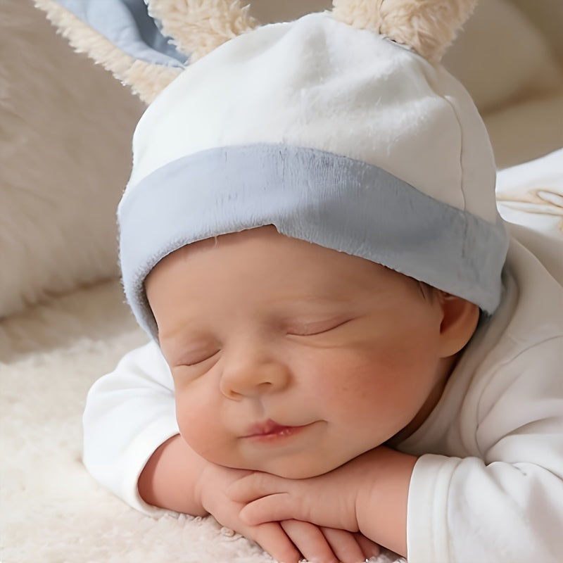 48 cm lebensechte handbemalte Reborn-Babypuppe Pascale mit geschlossenen Augen.