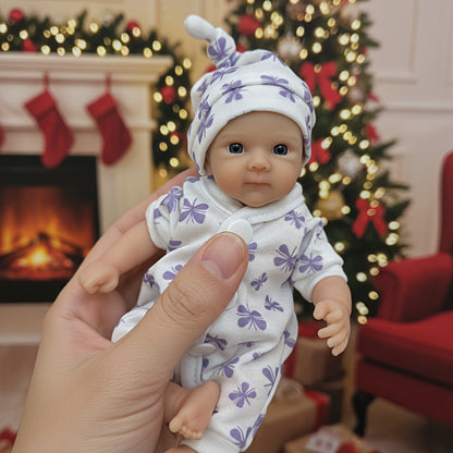20cm Mini Bettie Reborn Babypuppe aus Silikon mit offenen Augen im lila geblümten Jumpsuit