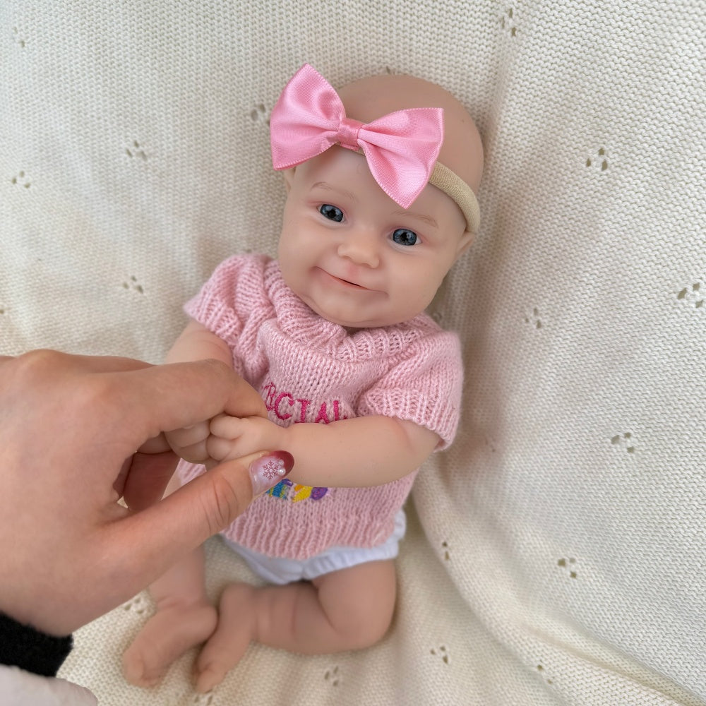 30 cm vollständig aus Silikon gefertigtes Reborn Baby Maddies Lächeln in rosa Outfits