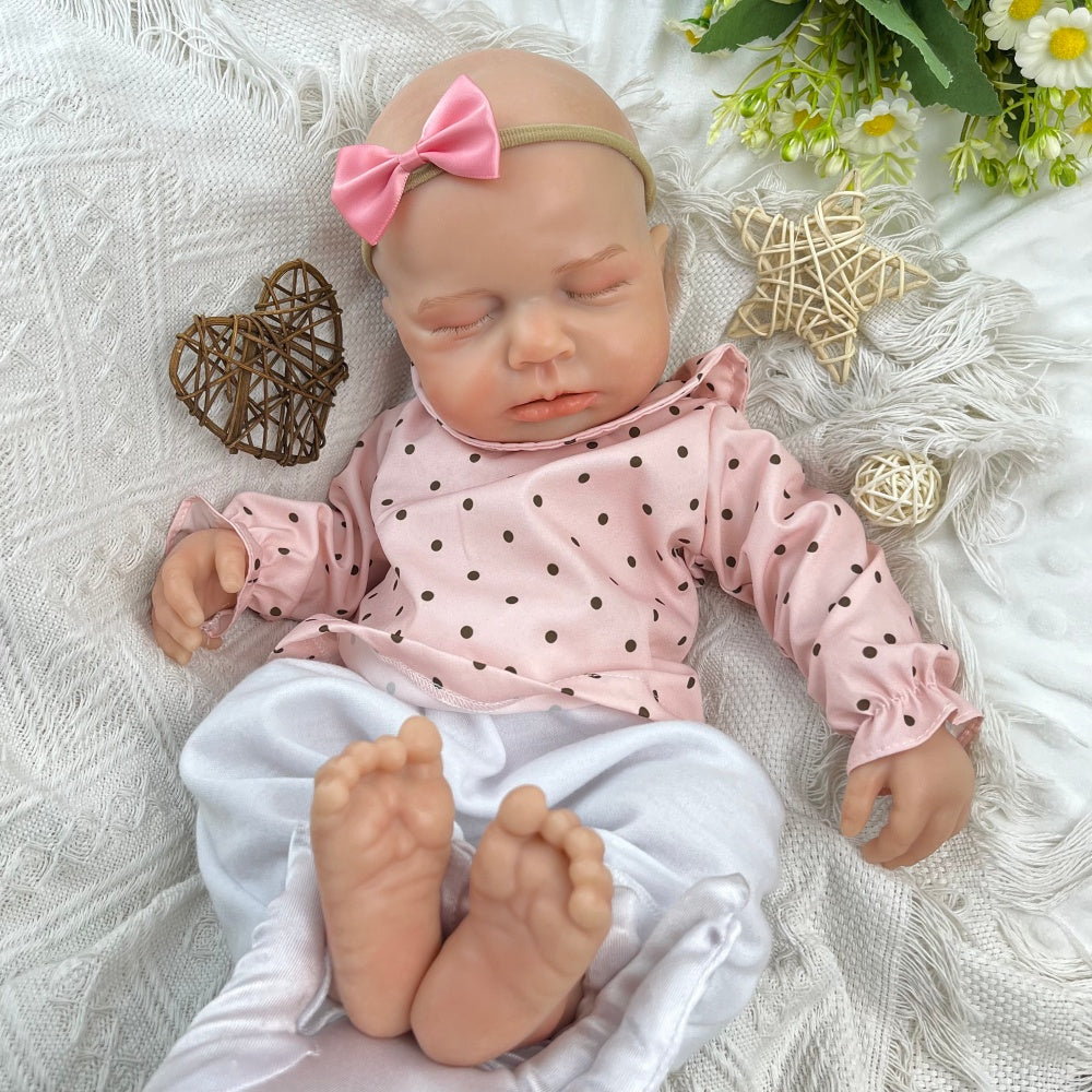 45 cm dehnbare Loulou Reborn Puppe aus Vollsilikon schlafend in rosa gepunktetem Outfit