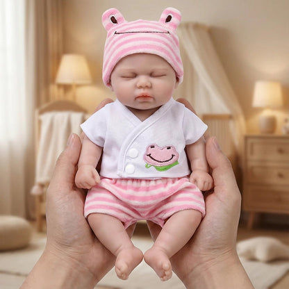 30 cm vollständig aus Silikon gefertigte Reborn Puppe Pickle mit geschlossenen Augen im rosa Frosch-Outfit