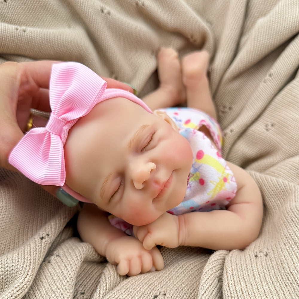 30 cm schlafende Pascale Reborn-Puppe aus Vollsilikon in rosa Blumenkleid