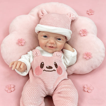 30 cm lebensechte Charlie Reborn-Puppe mit blauen Augen und einem strahlenden Lächeln aus Vollsilikon in rosa Bärenkleidung