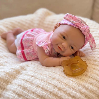 20cm Vivienne Reborn Puppe aus Vollsilikon im rosa geblümten Kleid