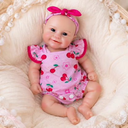 30cm Maddie Smile Reborn Babypuppe aus Vollsilikon im rosa Kirsch-Outfit