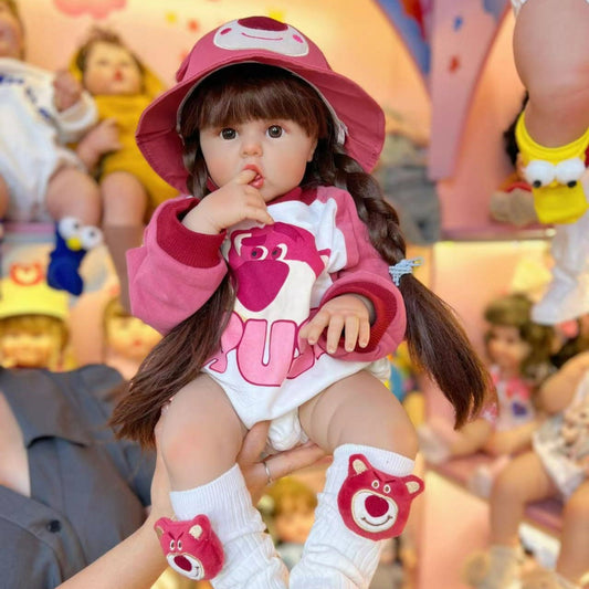 55/60cm Reborn-Baby-Mädchen mit langen Haaren in rosa Bärenkleidung