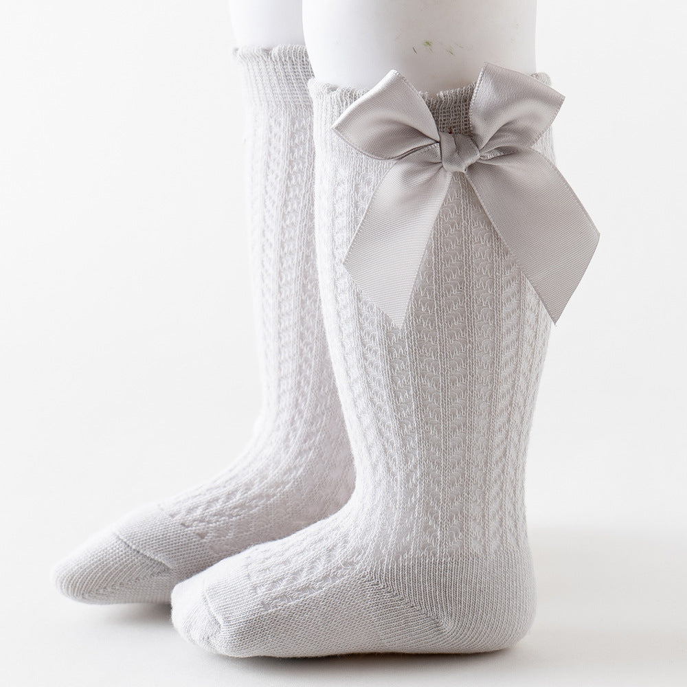 Oberschenkelhohe Netzsocken mit großer Schleife für Kinder