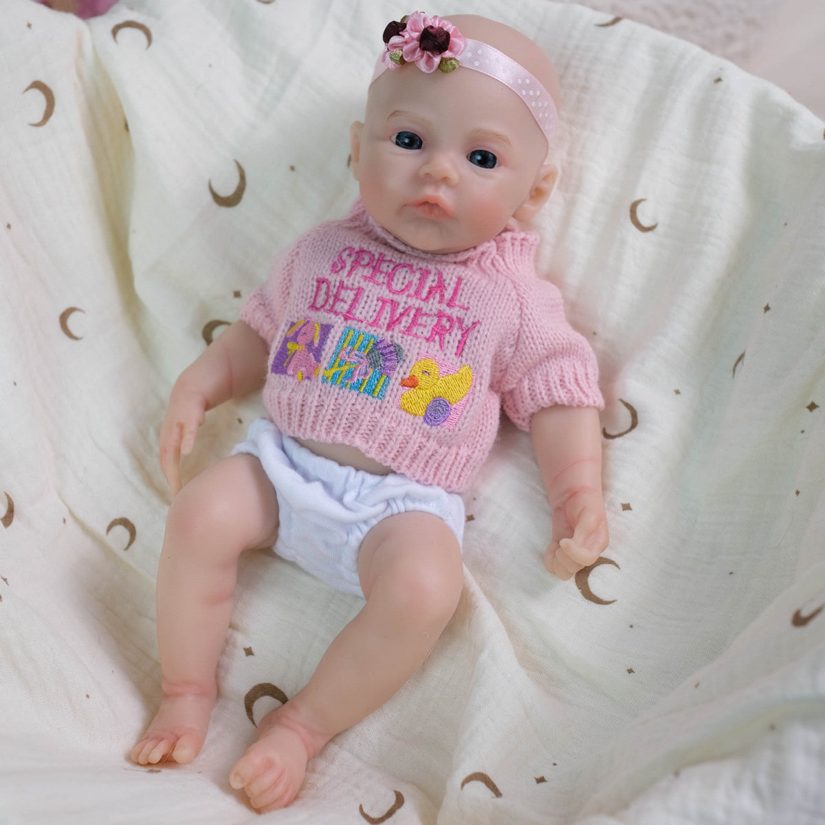30 cm weiche Silikon-Reborn-Babypuppe Mädchen Meadow im rosa Pullover