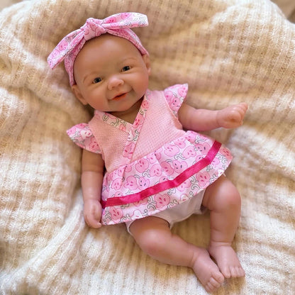 20cm Vivienne Reborn Puppe aus Vollsilikon im rosa geblümten Kleid