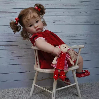 Stella 60cm Reborn Puppe mit blauen Augen und rotem Kleid