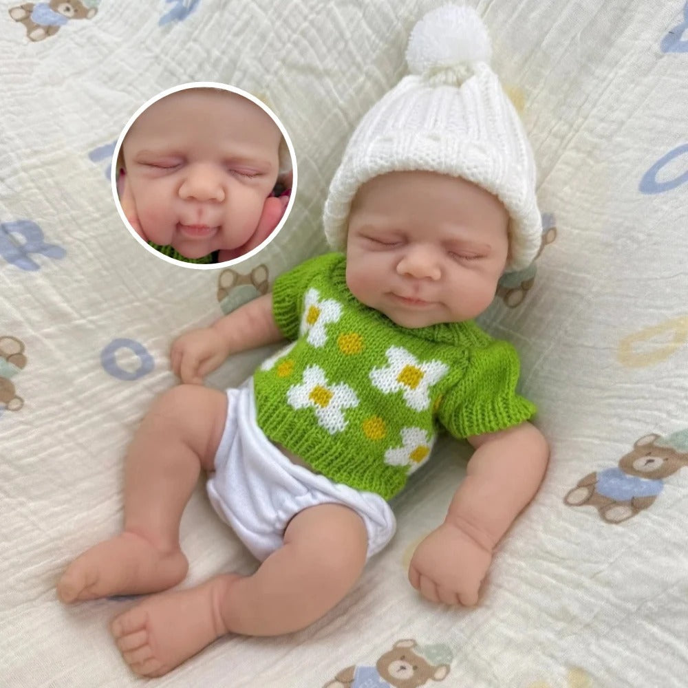 30 cm schlafende Pascale Reborn Puppe aus Vollsilikon in grünem Strickoutfit