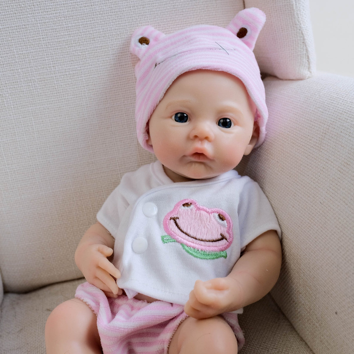 30 cm weiches Silikon-Reborn-Baby Mädchen mit blauen Augen und rosa Kleidung