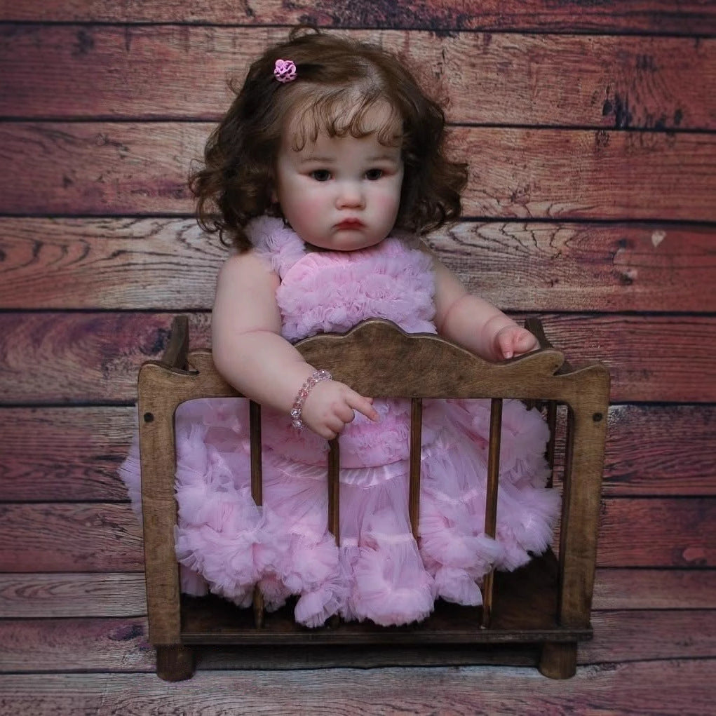 60 cm Reborn-Puppe mit offenen Augen und braunem Haar Charlotte im rosa Kleid
