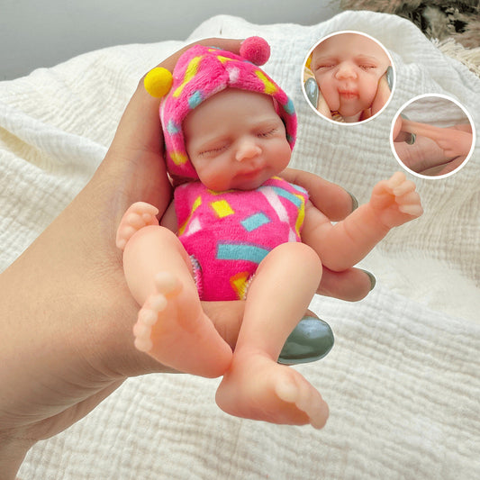 15 cm Silikon Reborn Puppe Pascale mit geschlossenen Augen in rosafarbenen Outfits