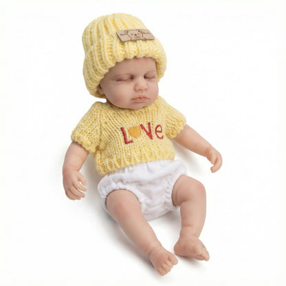 20 cm Loulou Reborn-Babypuppe aus Vollsilikon im gelben Pullover