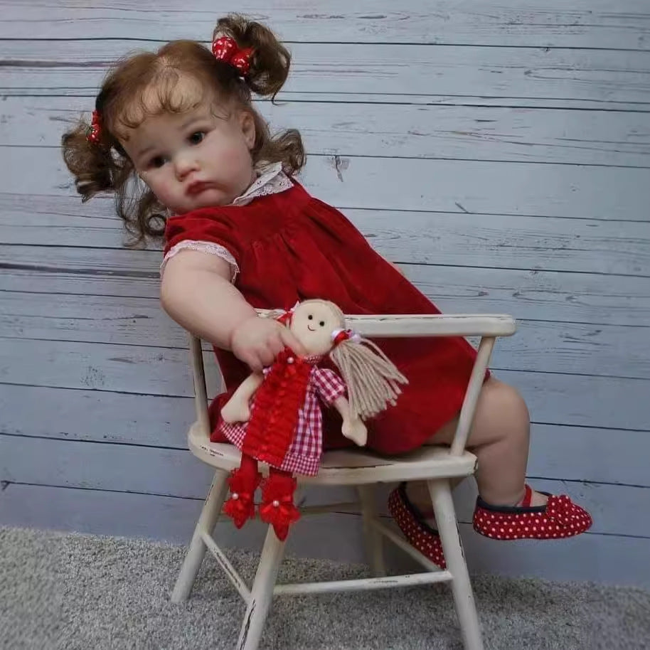 Stella 60cm Reborn Puppe mit blauen Augen und rotem Kleid