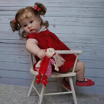 Stella 60cm Reborn Puppe mit blauen Augen und rotem Kleid