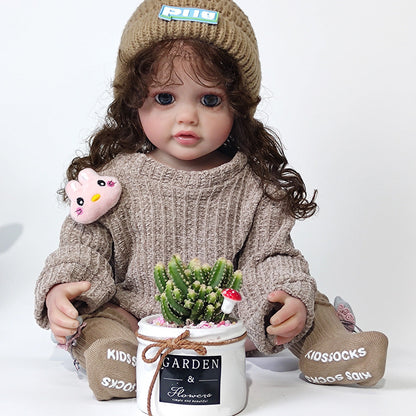 22 Zoll Reborn-Puppe mit lockigem Haar und braunem Pullover - Betty