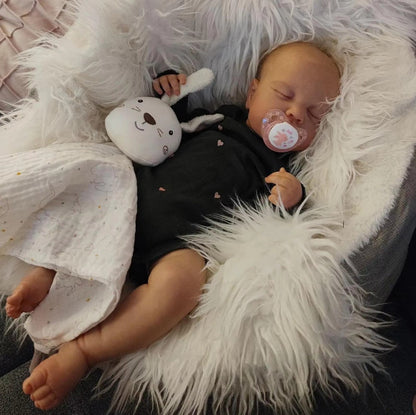 50 cm Reborn-Puppe mit geschlossenen Augen und weichem Körper in schwarzem Strampler - Loulou