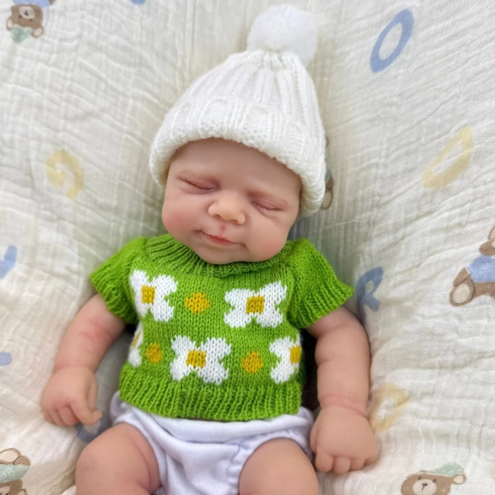 30 cm schlafende Pascale Reborn Puppe aus Vollsilikon in grünem Strickoutfit
