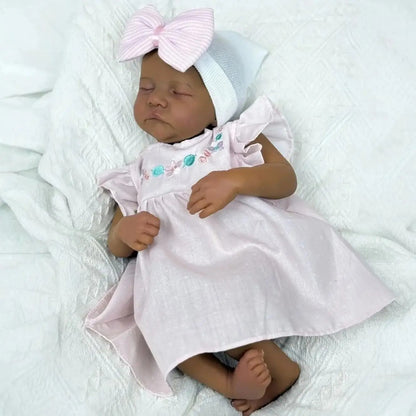 48cm Reborn Babypuppe Levi mit geschlossenen Augen dunkler Haut und weichem Körper im rosa Kleid