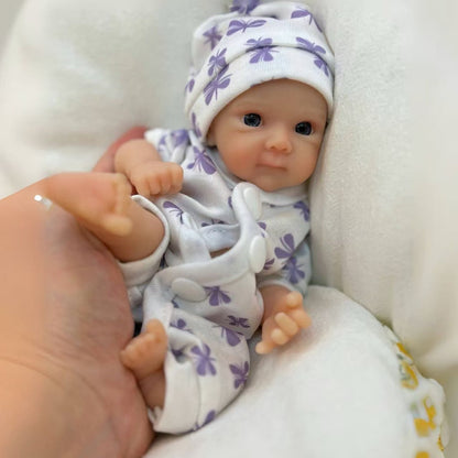 20cm Mini Bettie Reborn Babypuppe aus Silikon mit offenen Augen im lila geblümten Jumpsuit