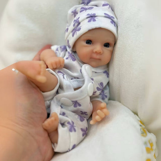 20cm Mini Bettie Reborn Babypuppe aus Silikon mit offenen Augen im lila geblümten Jumpsuit