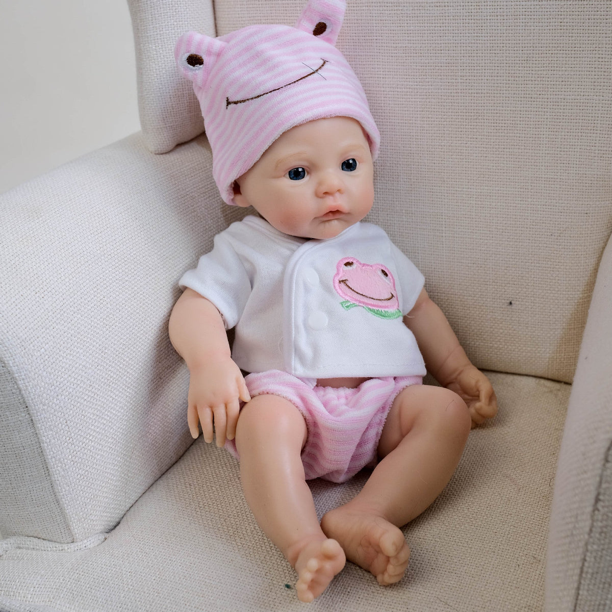 30 cm weiches Silikon-Reborn-Baby Mädchen mit blauen Augen und rosa Kleidung