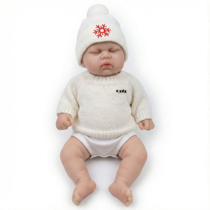 30 cm Reborn-Puppe Pickle aus Vollsilikon mit geschlossenen Augen im weißen Pullover