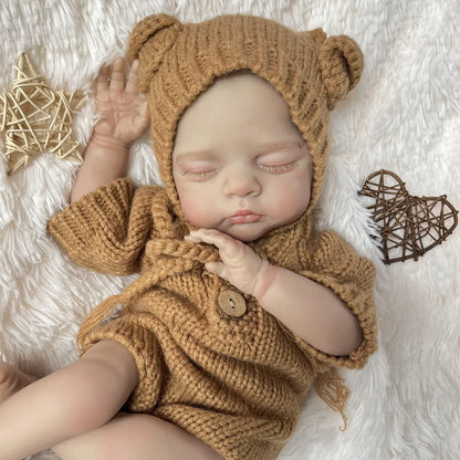 19 Zoll 3D-bemalte Reborn Puppe Irys mit geschlossenen Augen in brauner Strickkleidung